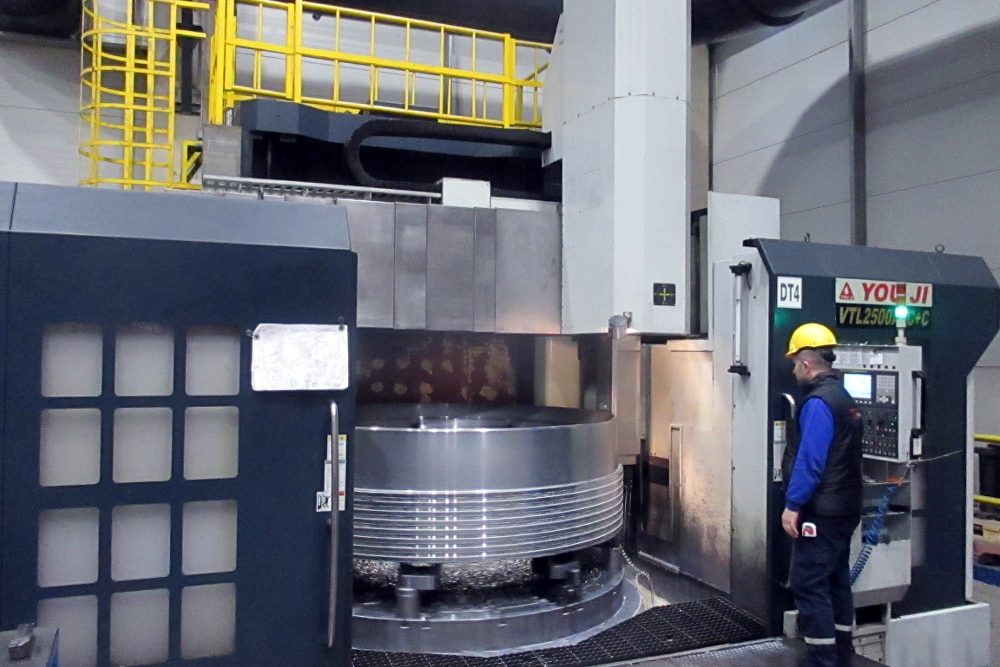 Vertical turning lathe TDZ VLC 2500 ATC machining a large ring component